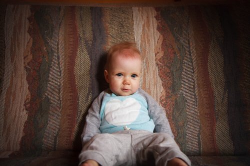 Sonja smiling on the futon